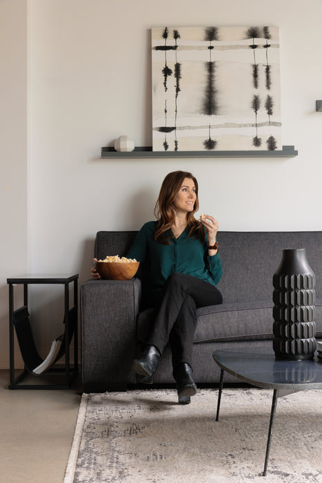 Violet Sofa in the fabric Creston Smoke. The model is 5' 6".