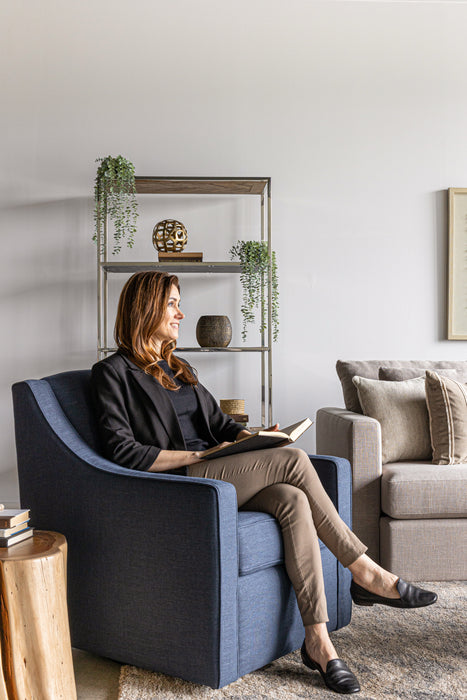 Jenna Swivel Chair in the fabric Campbell Splash &  Isaac Sectional, Sofa Return + 1  Arm Loveseat in the fabric Campbell Concrete. The model is 5' 6".
