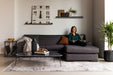 Violet Sofa Chaise in the fabric Creston Smoke. The model is 5' 6".